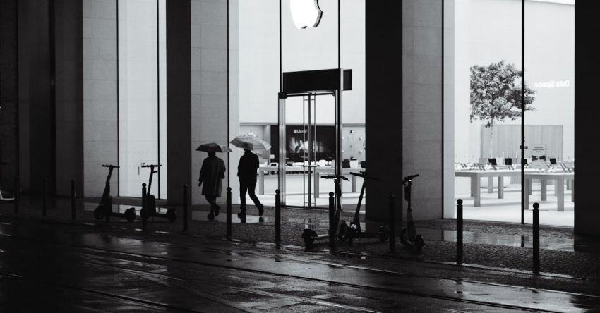 Electric Scooters - Black and white photo of people walking in the rain