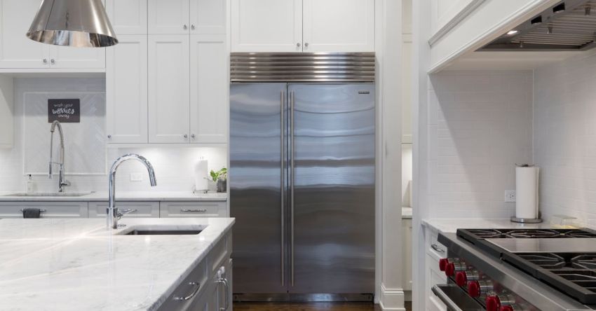 Refrigerator - Stainless Steel Refrigerator Beside White Kitchen Cabinet