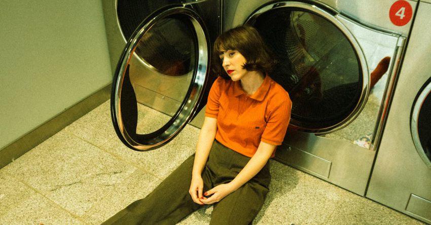 Washing Machines - Woman Sitting on the Floor